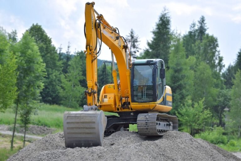Excavator digging at site