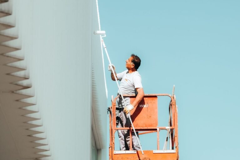Painter painting house exterior