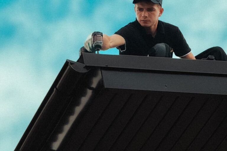 Roofing workers installing shingles
